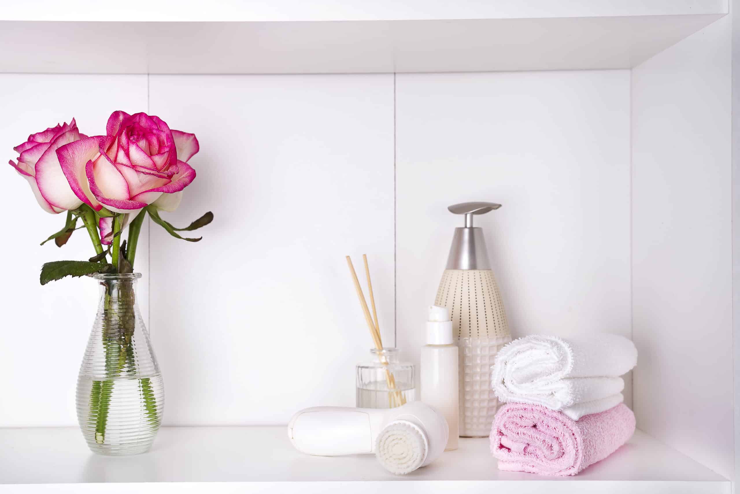 Spa bath cosmetic and flower rose, isolated on white